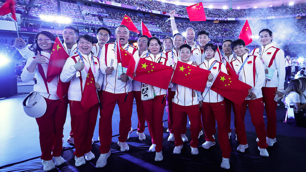 体育热点：中国代表团壮举获好评